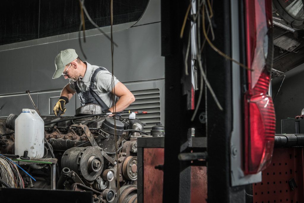 Automotive Technician Restoring Old Diesel Engine